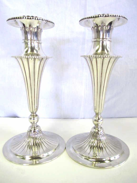 TIFFANY & CO. ART REGENCY STERLING CANDLESTICKS: Circa 1902-1907 Charles T. Cook Pair Tiffany & Company Turn of the Century Sterling Silver candlesticks with original removable bobeches. Fluted trumpet form with beaded rims ascending from a pedestal