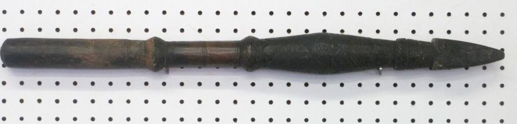 19TH CENTURY AFRICAN CARVED SPEAR CLUB WEAPON: 19th Century African carved ritual club weapon. Ebony hardwood with carved geometric motifs . Arrow head form top. L 28". Dark patina