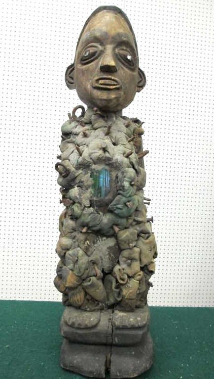 AFRICAN NKISI NKONDI POWER FETISH - KONGO: 19th Century Nkisi Nkonde carved figural wood power figure fetish statue with glass & nails. Green glass passage way for spirits . Kongo tribe Congo Central Africa . H 22"