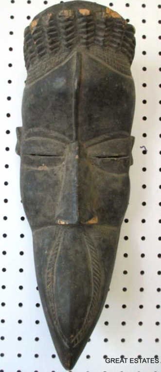 ANTIQUE CARVED AFRICAN INJO OGONI TRIBE MASK: Antique African mask. Probably Nigeria, Injo tribe or Ogoni. Untouched surface, with deteriorated edges on reverse. H 16.50"