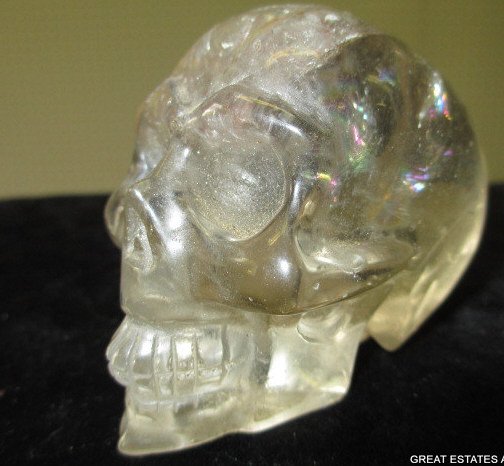 ANTIQUE CARVED ROCK CRYSTAL SKULL: Antique carved rock crystal skull of unknown origin, 19th Century, possibly earlier. 2 1/2" Height x 3" Length