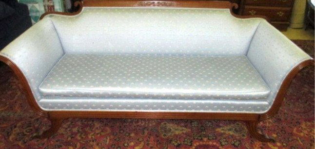 DUNCAN PHYFE FEDERAL SOFA: Duncan Phyfe / Federal sofa . Carved walnut acanthus crest with volutes & scrolled arms. Brass paw feet. H 33" x L 79.50". Minor stains. Please contact an outside shipper for this lot.