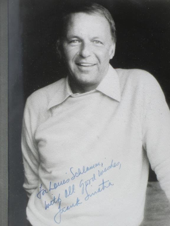FRANK SINATRA AUTOGRAPHED PHOTOGRAPH: Frank Sinatra autographed black & white photograph . Inscribed & signed in blue ink "For Louis Schlamm With All Good Wishes, Frank Sinatra " 11.50" x 14.50" framed.