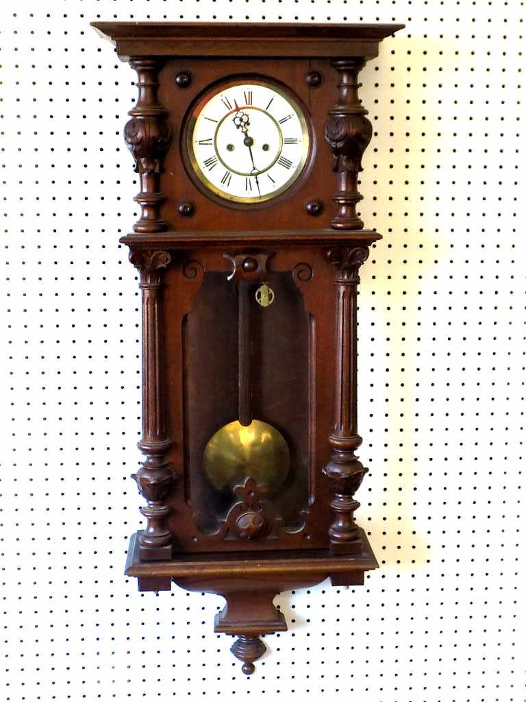 19TH C. CORINTHIAN VIENNA WALL CLOCK: 19th Century Victorian Vienna regulator wall clock . Carved Mahogany with Corinthian columns, draped Acanthus & Urns. Porcelain dial with original brass weights & pendulum. 42" x 7.50" x 17". Lower le
