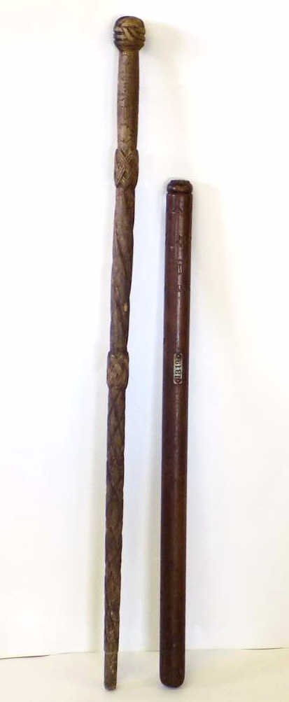 AMERICAN FOLK ART CARVED CANE & POLICE BATON: American Folk art carved cane / walking stick . Along with a heavy carved oak police baton / night stick American shields , stars & clovers carved. Cane L 34". Club L 26".