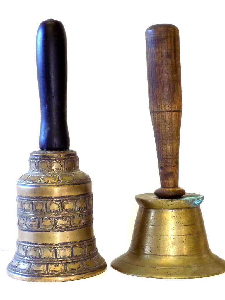 19TH CENTURY WOOD HANDLED BRONZE BELLS: 2 19th Century Bronze bells . 1st with highly detailed cast motifs & patinized ebony handle, along with another early cast bell with carved oak handle . H 9"