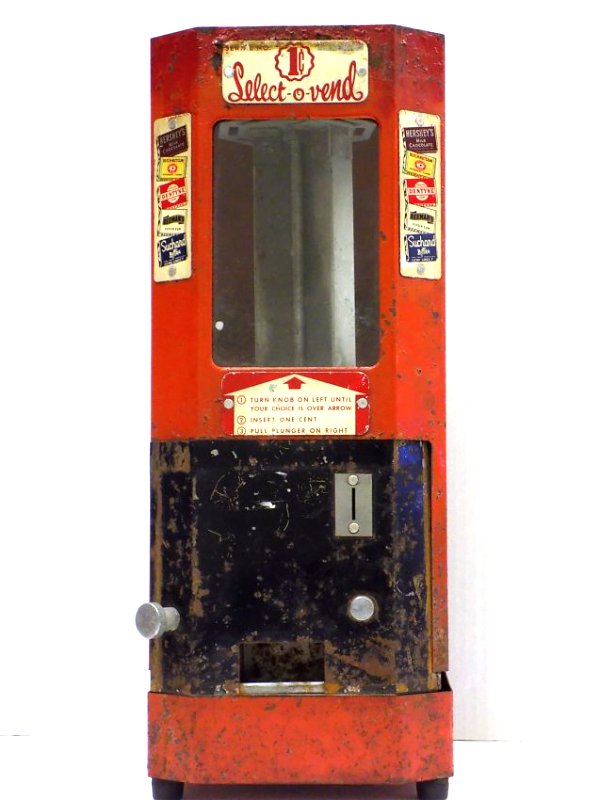 SELECT O VEND COIN OP CANDY VENDING MACHINE Circa: Circa 1940's Select O Vend Coin operated Candy 1 Cent Vending Machine. Metal Advertising panels featuring Hershey's Milk Chocolate Bars, Beech Nut Chewing Gum, Adams Dentyne Gum, Beemans Pepsin Gum, S
