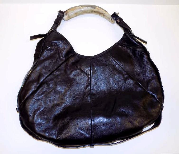YVES SAINT LAURENT STAG HANDLE HAND BAG Yves Saint: Yves Saint Laurent Designer black leather hand bag / purse with Silver mounted Stag handle. Original paperwork and $795.00 Price tag included. 12" x 16"