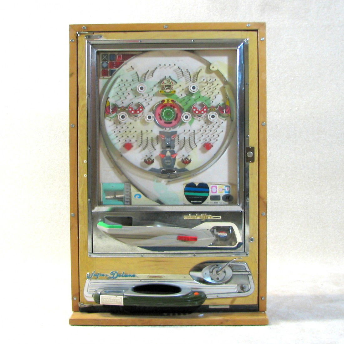 Vintage Japanese Pachinko Pinball Game: Vintage vertical pinball game called Pachinko. The entire game and mechanism are in a wood case. Flips open to reveal backside. Due to this design it can be mounted into a wall. Large piece.