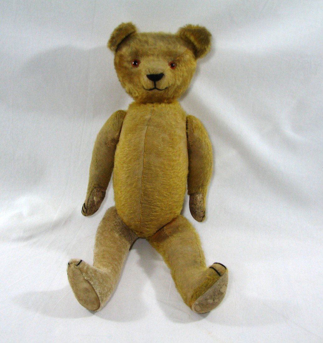 Antique Mohair Teddy Bear: Fantastic antique teddy bear, crafted in long mohair. Clean. Black nose. Slight hump in back. Glass eyes. When turned parts can be heard moving inside him. Smells fresh, from a non smoking estate. He 