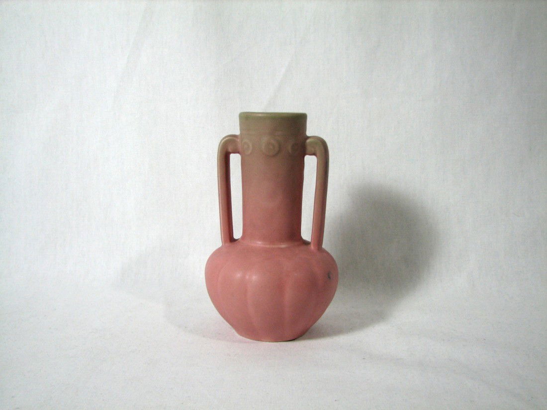 1930s Rookwood Amphora Vase: 1933 Rookwood amphora shape vase, glazed in dusty rose with a touch of grey-green at the top. Swirl motif repeated at neck and top of arms. Slight blue color transfer on arm and body when in bisque fo