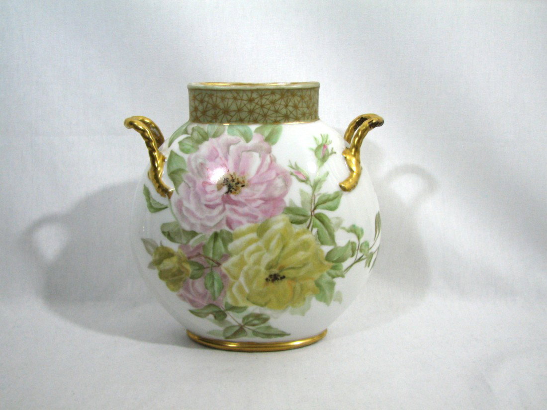 Antique Limoges Doubled Handled Vase, Roses: Hand painted Limoges porcelain vase with painted antique gold handles, base, and rim decoration. Delicately hued pink and yellow cabbage roses in full bloom on one side. A heavy-hanging pink rose ador