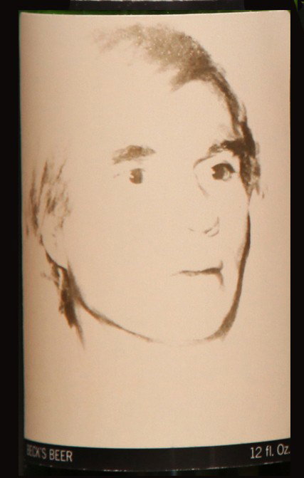 Self-Portrait: Closed bottle. Front label displays the self-portrait and the back label displays the year. Each bottle comes with their own showcase. (does not include bottle in the picture)
