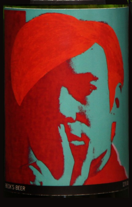 Self-Portrait: Closed bottle. Front label displays the self-portrait and the back label displays the year. Each bottle comes with their own showcase. (does not include bottle in the picture)