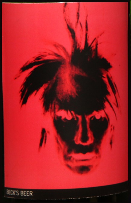 Self-Portrait: Closed bottle. Front label displays the self-portrait and the back label displays the year. Each bottle comes with their own showcase. (does not include bottle in the picture)