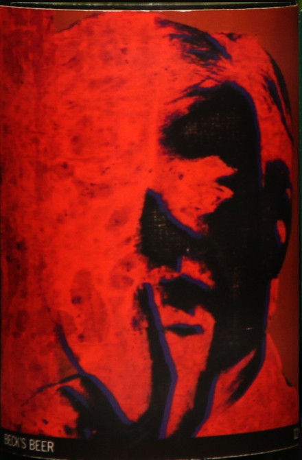 Self-Portrait: Closed bottle. Front label displays the self-portrait and the back label displays the year. Each bottle comes with their own showcase. (does not include bottle in the picture)