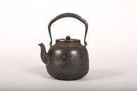 A GOLD AND SILVER INLAID IRON TEA KETTLE