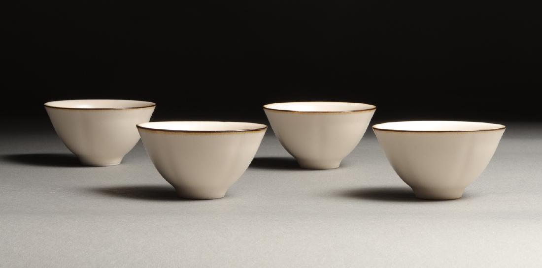 A SET OF FOUR XIAOFANG KILN WHITE-GLAZED TEA CUPS: H:7.8cm * 4