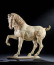 AN ARCHAIC POTTERY HORSE, TANG DYNASTY