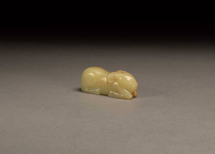 A CARVED WHITE JADE CROUCHING RAM, SONG DYNASTY