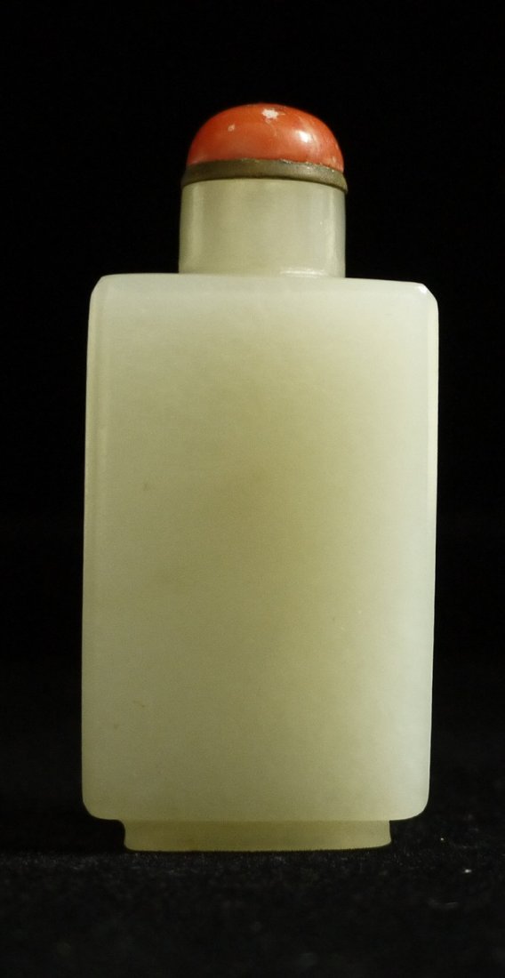 A White Jade Snuff Bottle: A white jade sunff bottle with rectangular cross-section, with plain surface, measure 6.2cm high, dates from the Qing dynasty.