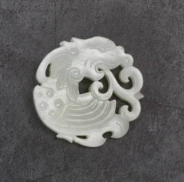 A WHITE JADE OPENWORK DRAGON PENDANT, QING DYNASTY