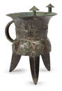 A RARE AND FINE ARCHAIC BRONZE WINE VESSEL WITH BEAST FACE PATTERN, LATE SHAN DYNASTY