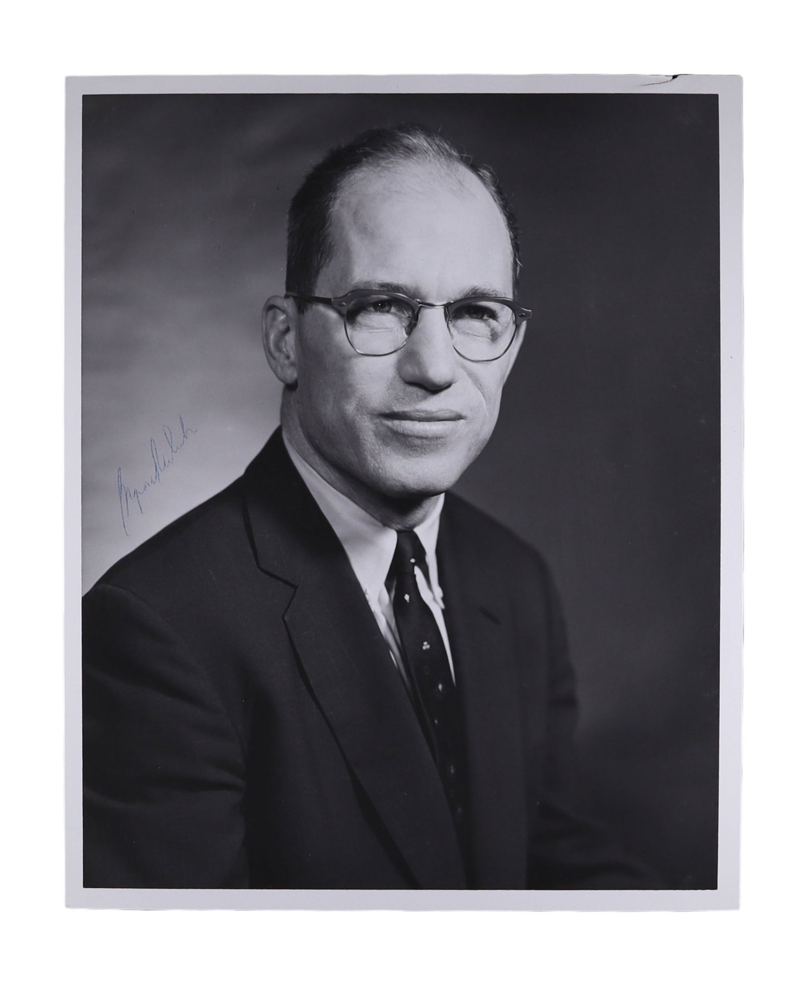 BYRON WHITE SIGNED LARGE FORMAT PORTRAIT PHOTOGRAPH, PRE COURT IMAGE IN BUSINESS SUIT: Byron R. White (1917-2002) led a notably notable lives of any Justice in Supreme Court history. A Rhodes Scholar, a decorated naval intelligence officer in World War II, and the leading rusher in the 