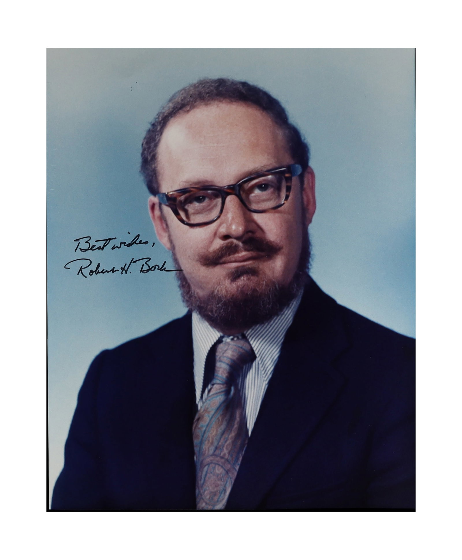 ROBERT H. BORK SIGNED PORTRAIT PHOTOGRAPH THE MOST CONTROVERSIAL SUPREME COURT NOMINEE IN AMERICAN: Robert H. Bork (1927-2012), the federal circuit judge and legal scholar whose 1987 Supreme Court nomination battle transformed American political and judicial culture, signs a color portrait with the 