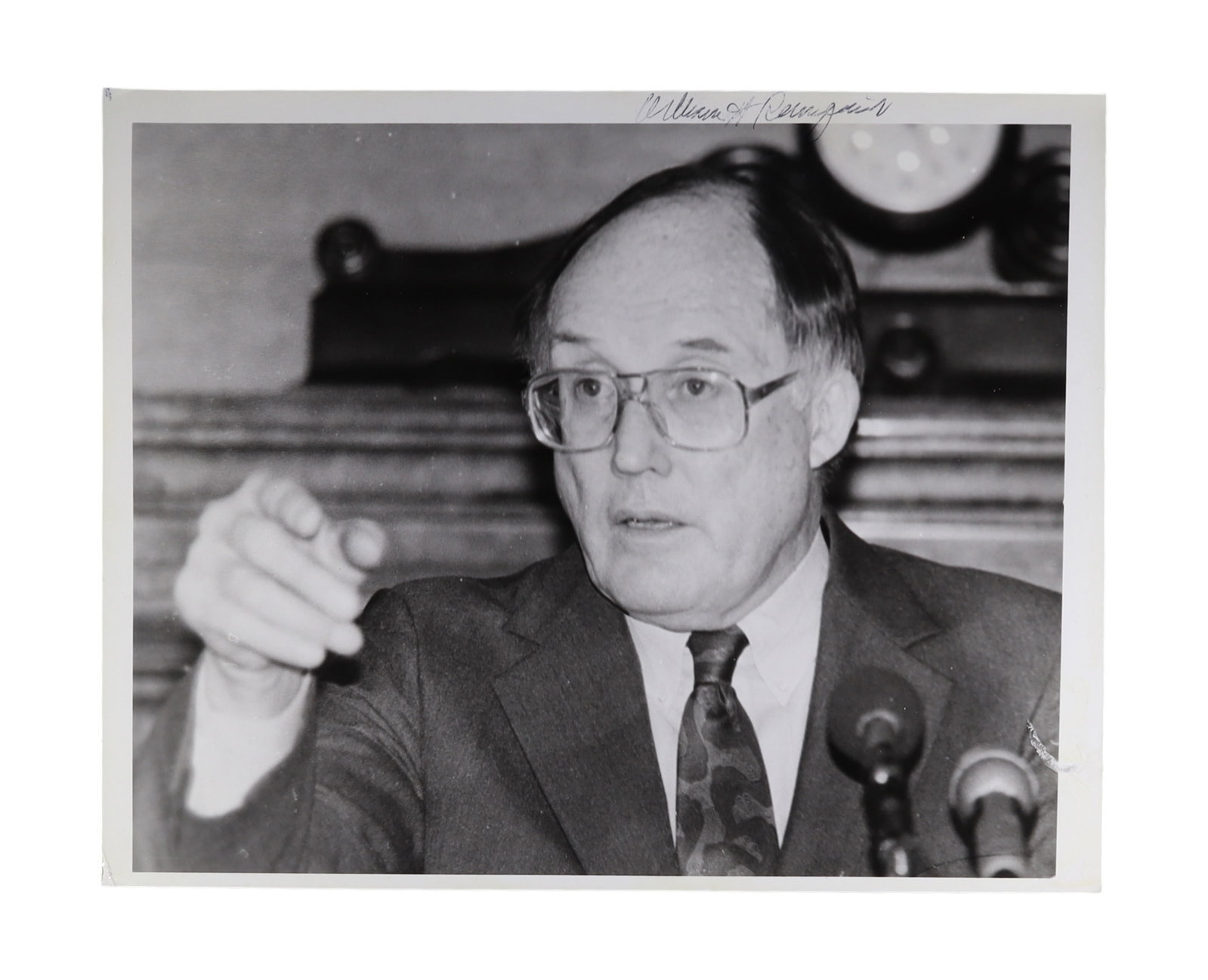 WILLIAM H. REHNQUIST SIGNED CANDID PRESS PHOTOGRAPH, ACTION IMAGE AT PODIUM: William H. Rehnquist (1924-2005) served on the Supreme Court for thirty three years, first as Associate Justice from 1972 and then as Chief Justice from 1986 until his death in 2005. Appointed by Pres
