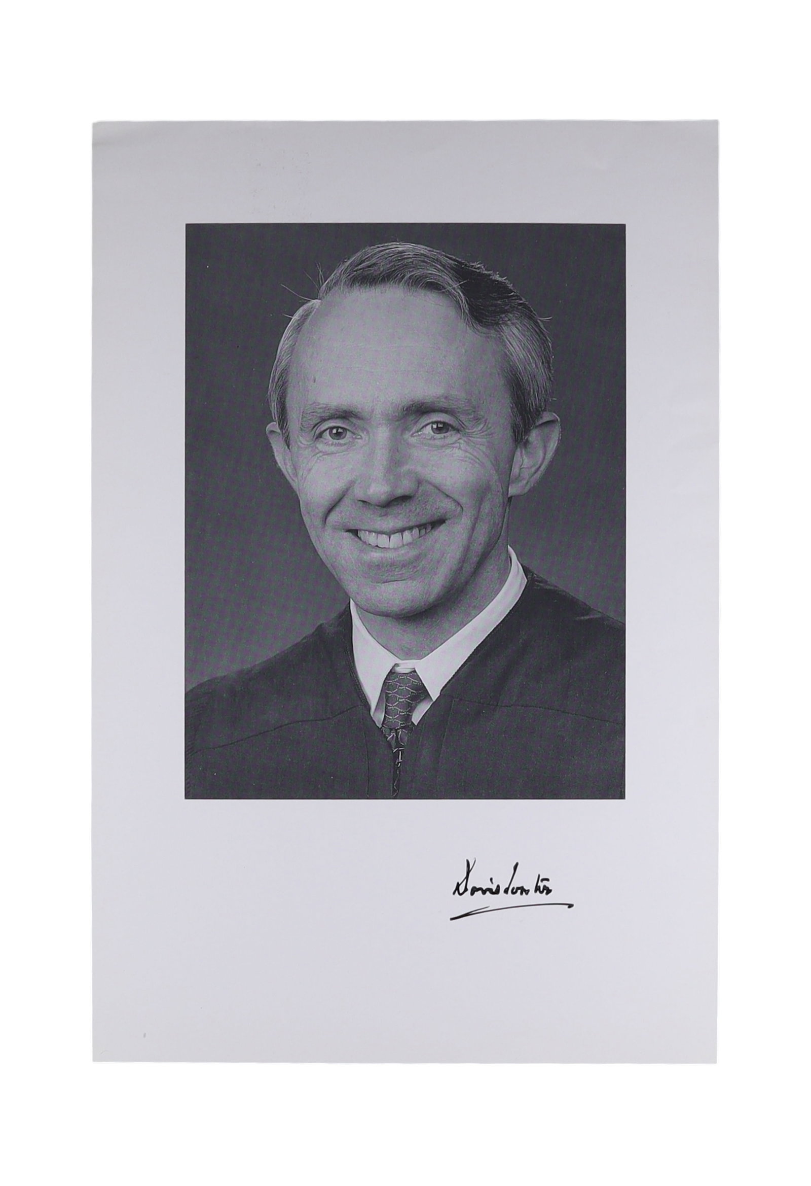 DAVID SOUTER SIGNED OFFICIAL PORTRAIT PHOTOGRAPH: David H. Souter (b. 1939) served as an Associate Justice of the Supreme Court from 1990 to 2009, appointed by President George H.W. His signature appears below the black ink, written in his distinctiv