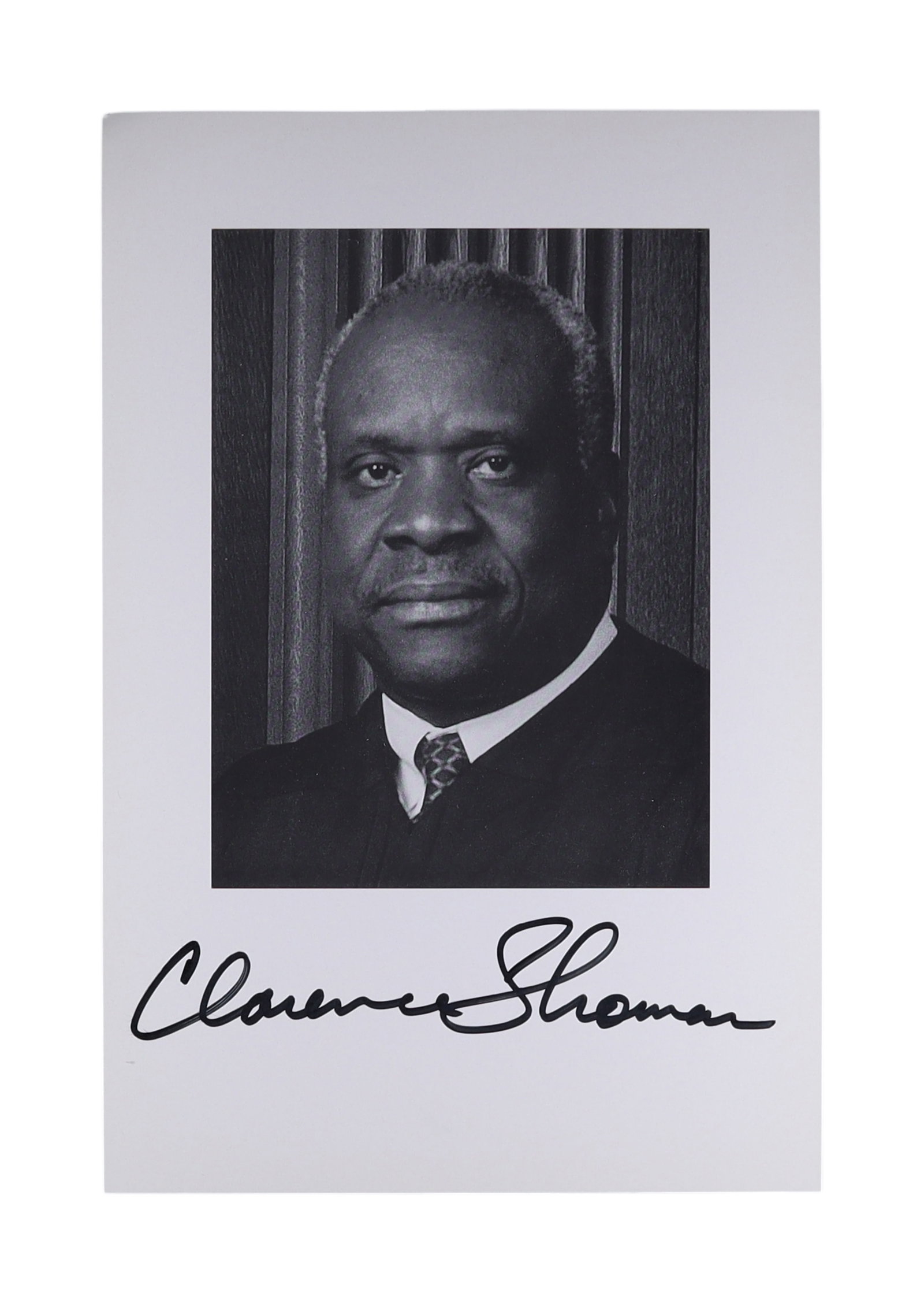 CLARENCE THOMAS SIGNED OFFICIAL PORTRAIT PHOTOGRAPH: Clarence Thomas (b. 1948) has served as an Associate Justice of the Supreme Court since 1991, appointed by President George H.W. Bush following a notably contentious confirmation hearings in the insti