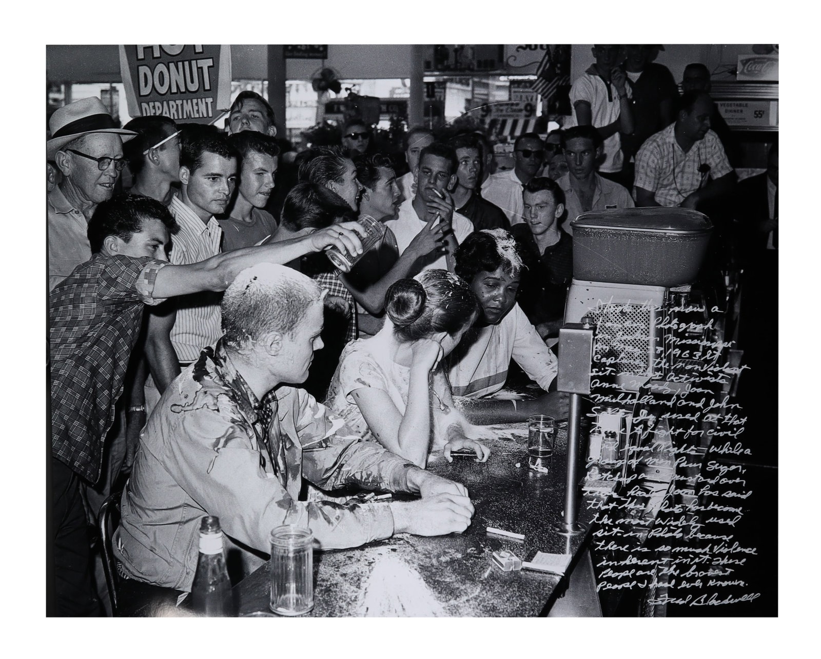 FRED BLACKWELL SIGNED COMPOSITE PHOTOGRAPH WITH HANDWRITTEN TESTIMONY THE ICONIC MISSISSIPPI LUNCH: The at the center of this lot is a notably widely reproduced of the American civil rights movement: a 1963 Mississippi lunch counter sit in captured at the moment a white aggressor pours a liquid over