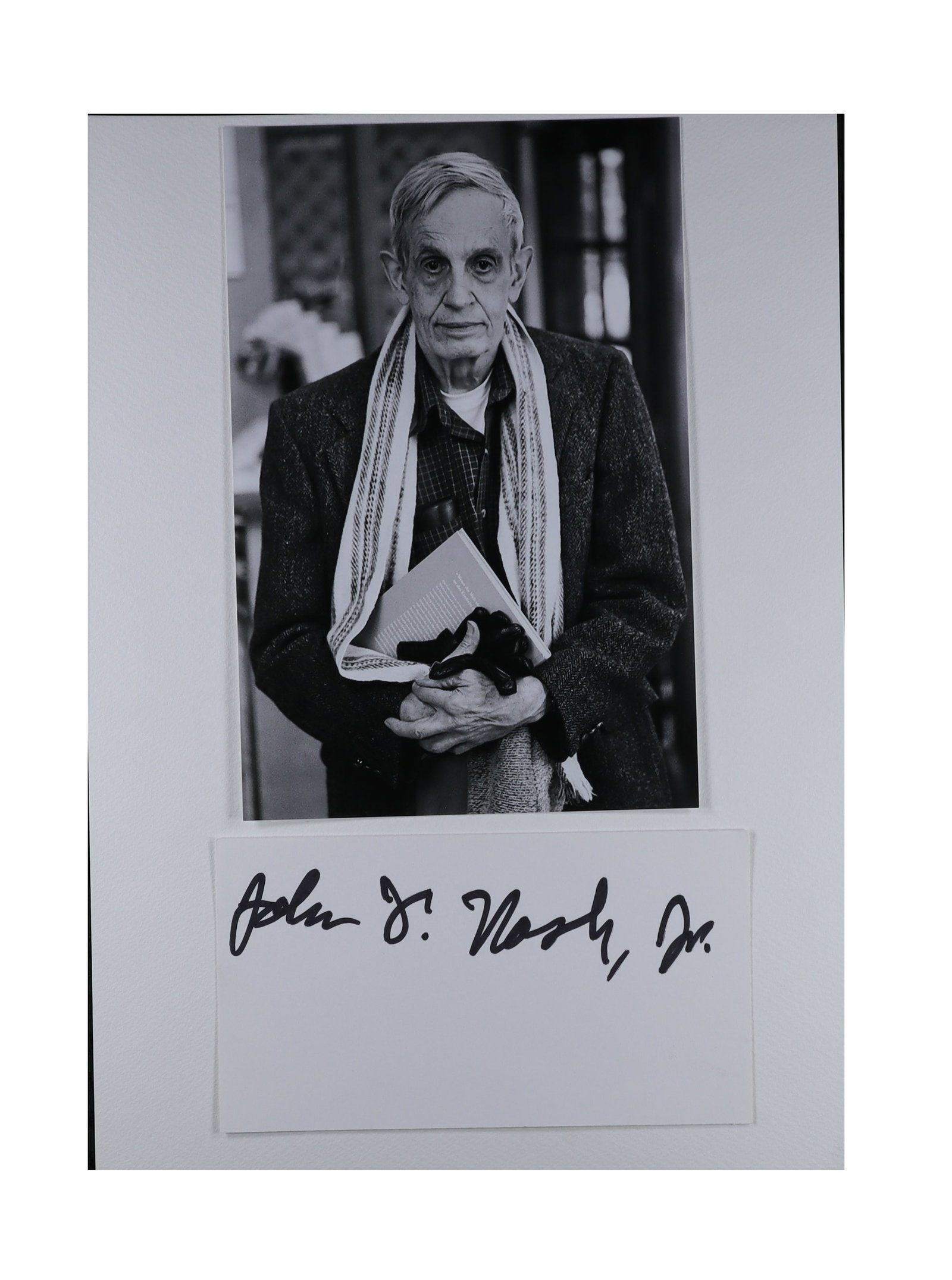 John F. Nash Jr. Signed Card with Photograph: Nobel Laureate and Subject of "A Beautiful Mind": John F. Nash Jr. Signed Card with: Nobel Laureate and Subject of "A Beautiful Mind. " John Forbes Nash Jr. Black and white of Nash in later years, wearing a scarf and holding a book, matted above a si