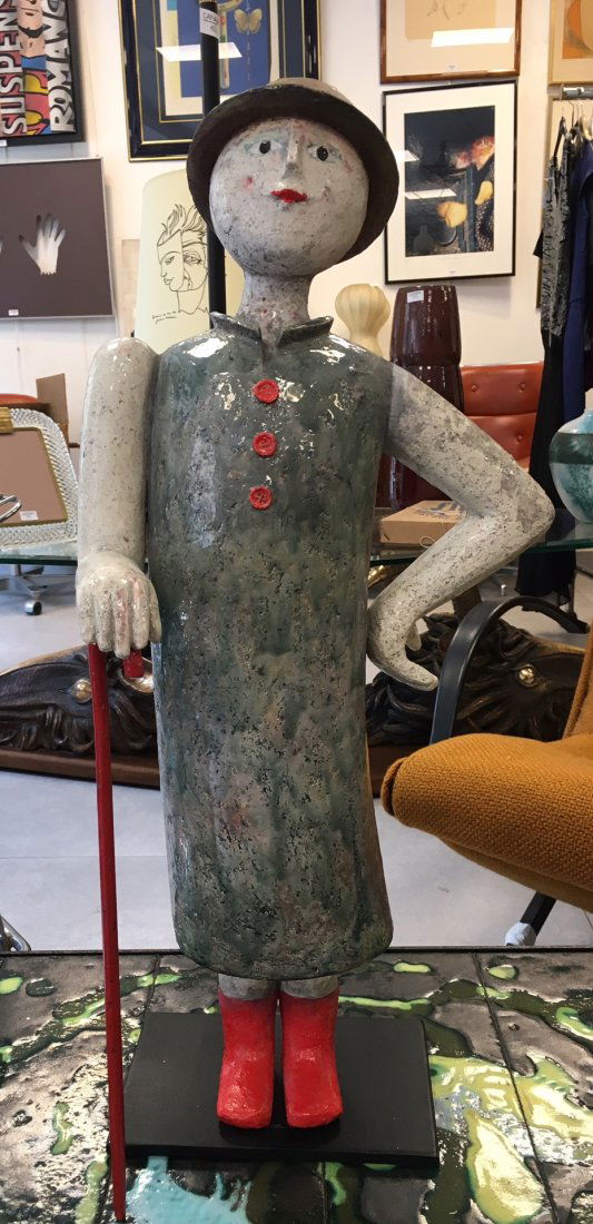 CLEM: CLEM (1982)CharlélieSculpture en raku émaillé polychrome sur base en métalH : 61 cm N.B: Formée par le regretté Roger Capron, célèbre artiste de Vallauris, Clémence Dancoisne dite Clem, obtie