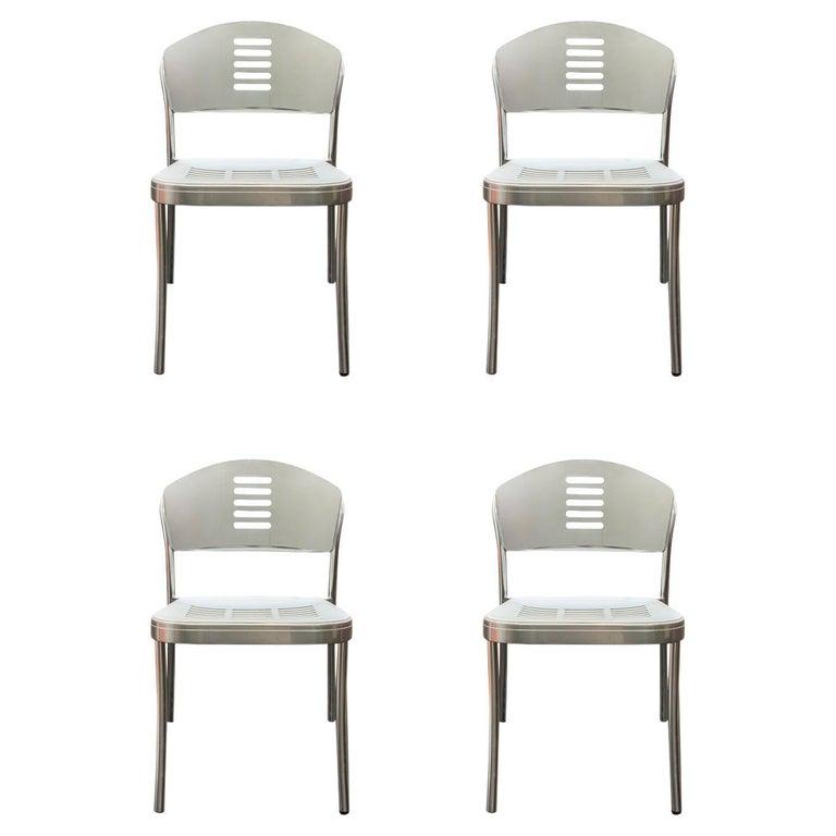 MAGISTRETTI - 4 CHAISES EN ALUMINIUM: Vico MAGISTRETTI (1920-2006) pour Kartell, Suite de quatre chaises en aluminium avec dossiers et assises en plastique blanc- Italie, vers 1990 55 x 45 x 77,5 cm * Vendu sur désignation