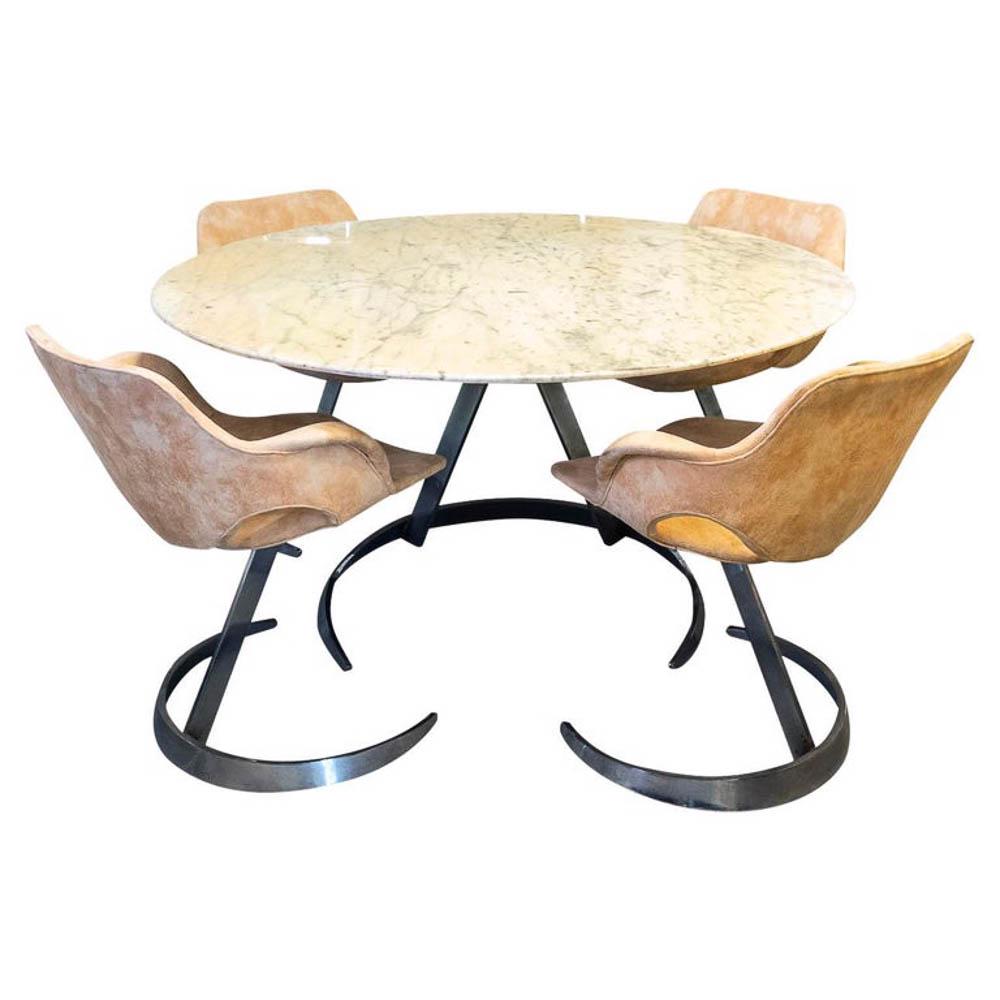 TABACOFF - TABLE ET 4 CHAISES: Boris TABACOFF (c.1927-1985)Ensemble comprenant une table Ã plateau en marbre et quatre chaises gainÃ©es de croute de cuirTable : 71 x 130 cmChaises : 74 x 63 x 50 cm *Vendu sur dÃ©signation