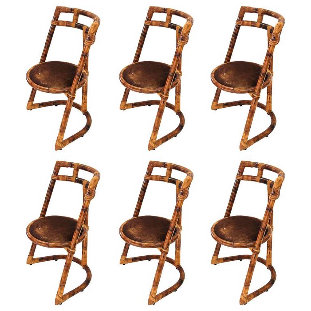 TRAVAIL DES ANNÃ‰ES 1970 - 6 CHAISES EN BAMBOU: Travail des annÃ©es 1970Suite de six chaises en bambou avec assise circulaire en peau - Vers 197050 x 40 x 85 cm* Vendu sur dÃ©signation
