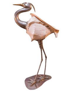 REDMILE - CIGOGNE EN MÉTAL ARGENTÉ: Anthony REDMILE (1940) Cigogne en métal argenté, coquillage, yeux en verre coloré Années 1970. 73 x 24 x 45 cm * Vendu sur désignation