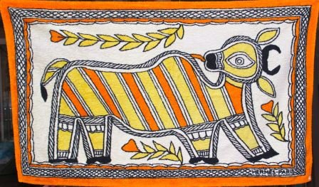 HERMES Serviette de plage à décor de « vache sacrée »: HERMES Serviette de plage à décor de « vache sacrée » dans des tons orangés Vers 2000 Etat d’usage