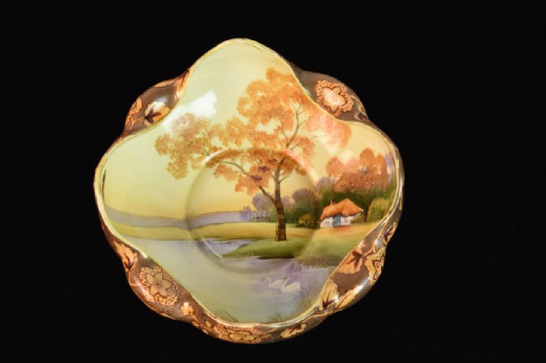 Antique Nippon Bowl With Scenic Landscape: Uniquely shaped Nippon Bowl with a Hand Painted Scenic Landscape in harvest colors. The outside of the bowl is a floral motif in golds, reds, and peach. The hand painted landscape scene is very detail