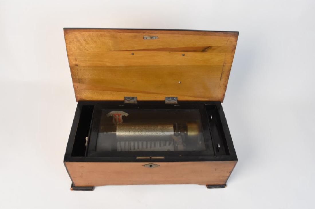 Antique Cylinder Musical Box: Antique Cylinder Music Box Belived To Be Swiss with 43 teeth on the one piece comb. This musical box comes with the winding lever and has compartment dividers separate from the inner lid. The inner li