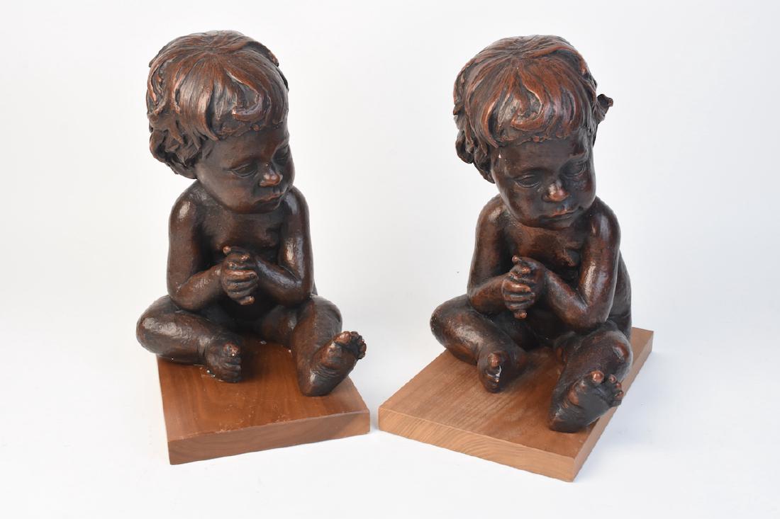 Pair of Big Head Babies Sculptures (1 of 5)