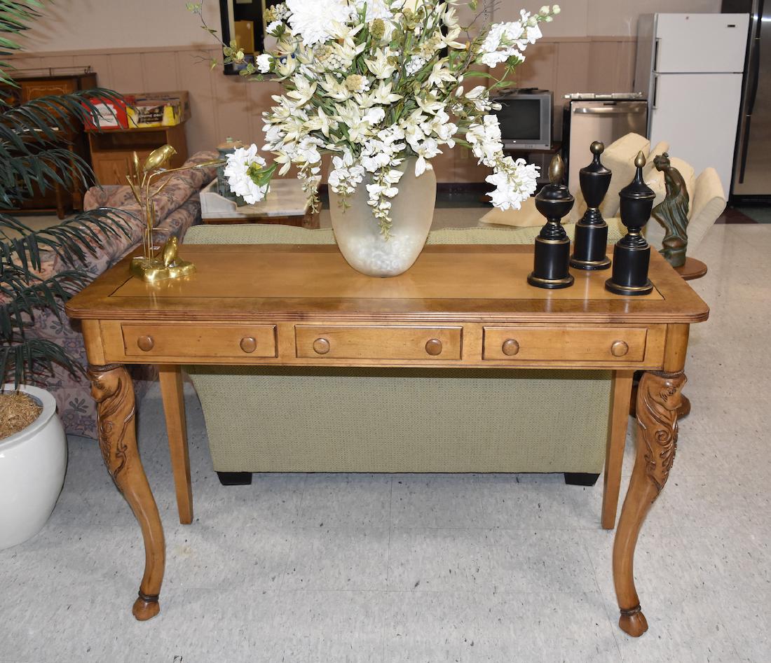 Sherrill CTH Sofa Entryway Table w/ Lion Head Legs: Make a grand statement with this Sherrill CTH sofa entryway table with majestically carved lion head front legs. 58" L x 22" W x 36" H. Only one drawer opens, the other two are not functional. Contact