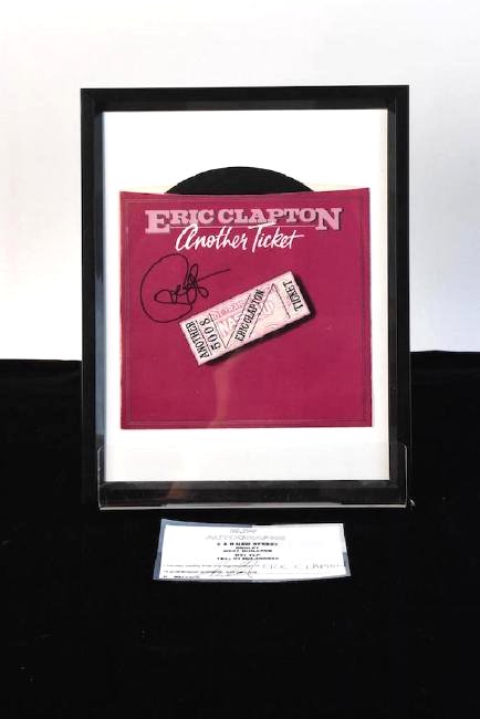Autographed 45 by Eric Clapton: Autographed 45 of Another Ticket by Eric Clapton framed with certificate of authenticity. This item is in very good condition and measures 9 1/2" x 12". Contact our recommended 3rd party "for profit" 