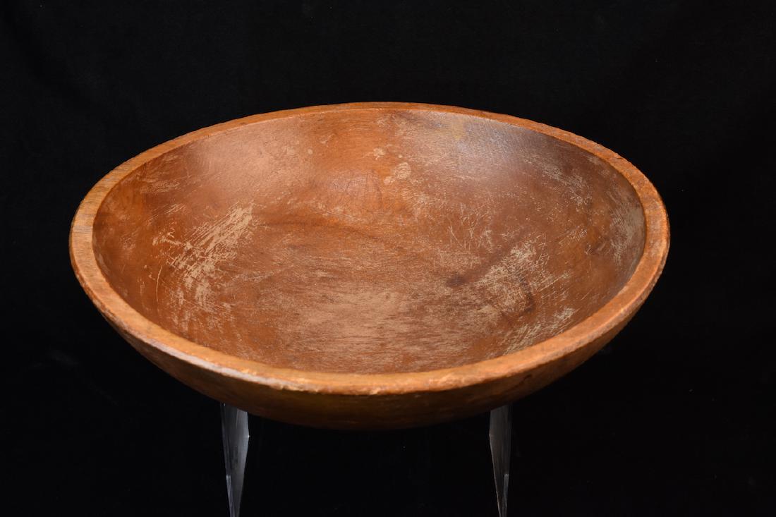 Primitive Wood Dough Bowl: Primitive Wood Dough Bowl with a diameter of 14 1/2". It stands 4" tall and is in good used condition with some scratches and wear. Contact our recommended 3rd party "for profit" shipper Pak Mail at (