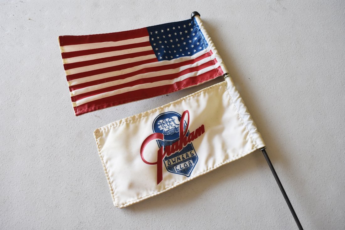 Graham Owners Club & American Flag: Graham Owners Club & American Flag on mountable base. Flags are 8 3/4' x 4 1/2". Contact our recommended 3rd party "for profit" shipper Pak Mail at (260) 637-4809 or contact@pakmailshipsfortwayne.com 