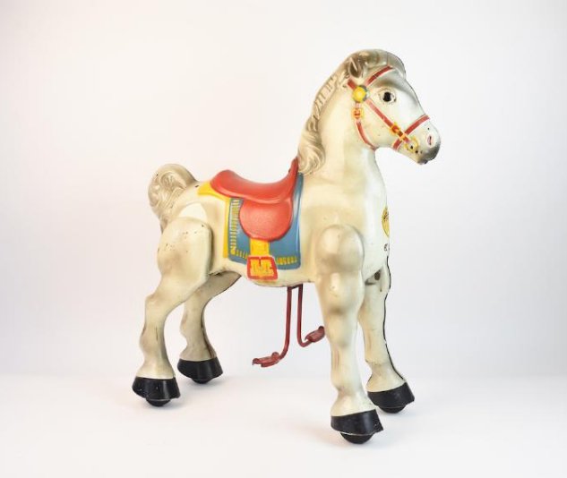 Mobo Walking Horse Bronco Ride-on Toy by Sebel & C: Mobo pressed steel bronco horse ride-on toy manufactured in England by Sebel & Co. This old fashioned children's toy dates back to 1947-1972. Horse moves forward on wheels when the rider pushes the st