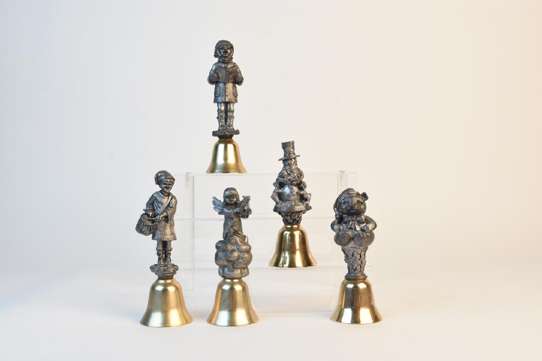 (5) Michael Ricker Christmas Bells: Michael Ricker pewter handled Christmas bells including 1986 "Kristopher", 1988 "Lyndsey", 1987 "Zane" and 1990 "Sue". Each of these bells comes with a certificate of cast and are numbered and signed.