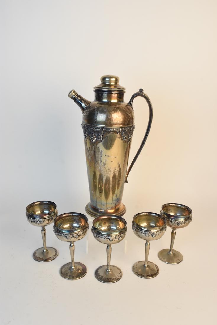 Crescent Silver MFG Wine Decanter & Chalices: Vintage Crescent Silver MFG Co. electroplated wine decanter and (5) matching chalices. Each piece is adorned with grapes, vines and foliage. It's a lovely set with minor wear and discoloration to the